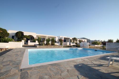 a villa with a swimming pool in a resort at Naoussa Hotel Paros by Booking Kottas in Naousa