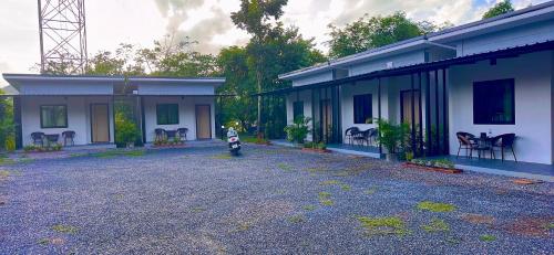 a motorcycle parked in front of a house at Palm Tree Resort in Ao Nang Beach