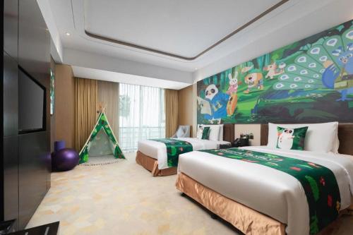 Ένα ή περισσότερα κρεβάτια σε δωμάτιο στο The QUBE Hotel Jingzhou