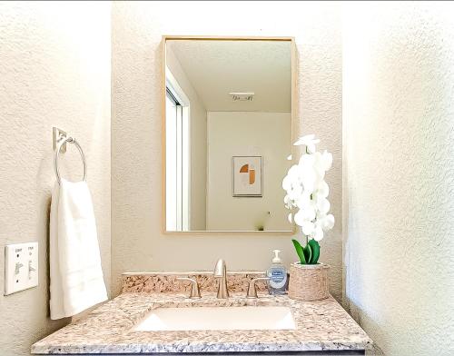 a bathroom with a sink and a mirror at Perfect Escape with Epic Views in Tucson