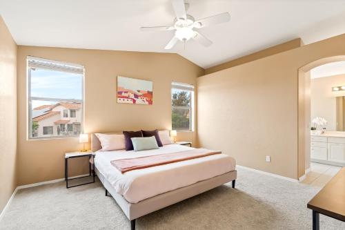 a bedroom with a bed and a ceiling fan at Perfect Escape with Epic Views in Tucson