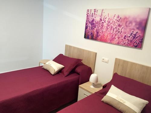 En eller flere senge i et værelse på Apartamentos Jurramendi - Los Arcos