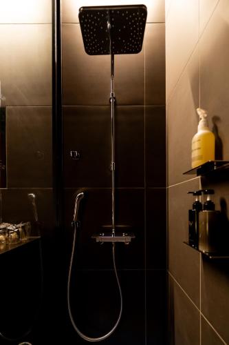a shower in a bathroom with a hose at 郷音 The Summit Club in Tsuru 