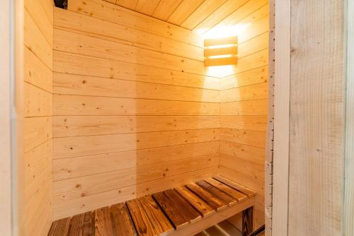 a wooden sauna with a bench inside of it at Chata u lanovky Pustevny in Trojanovice