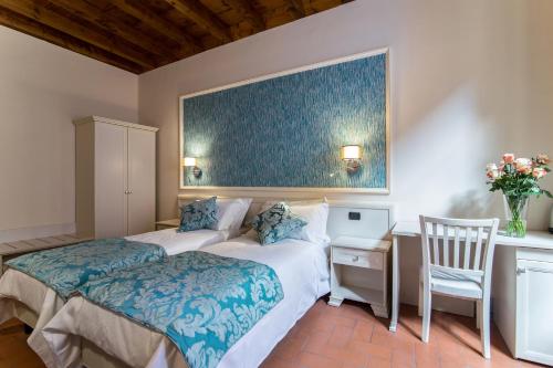 Postel nebo postele na pokoji v ubytování B&B Residenza Di Via Fontana