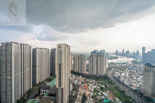 an aerial view of a city with tall buildings at The Peak Suite at Landmark Plus in Ho Chi Minh City