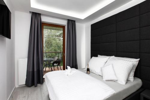 Posteľ alebo postele v izbe v ubytovaní Apartament Nadmorski Gold