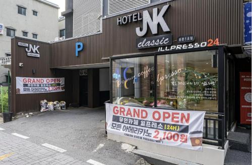 a store front with a grand open sign in front of it at Daejeon Yongmun JNK Classic Hotel in Daejeon