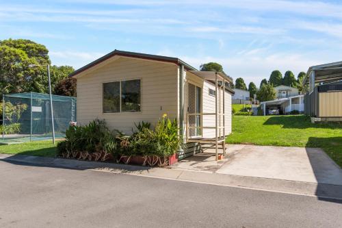 a tiny house on the side of a street at Moss Vale Village Park in Moss Vale