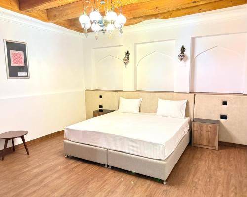 Ένα ή περισσότερα κρεβάτια σε δωμάτιο στο Hotel Misgaron
