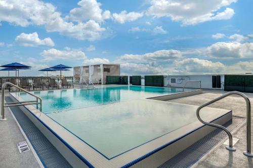 a large swimming pool on top of a building at Cambria Hotel St Petersburg-Madeira Beach Marina in St Pete Beach