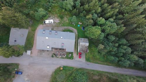 an overhead view of a large house in the woods at Naturfreundehaus Brend in Neuweg