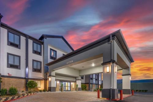 a rendering of a building with a sunset at Comfort Inn & Suites in Schulenburg