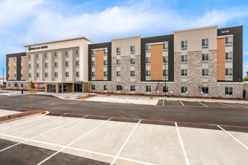 an empty parking lot in front of a hotel at Everhome Suites El Paso Airport near Fort Bliss by Choice Hotels in El Paso