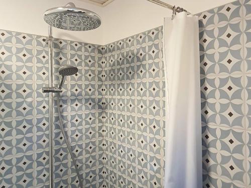 a shower with a shower curtain in a bathroom at 5 person holiday home in Tranekær-By Traum in Tranekær