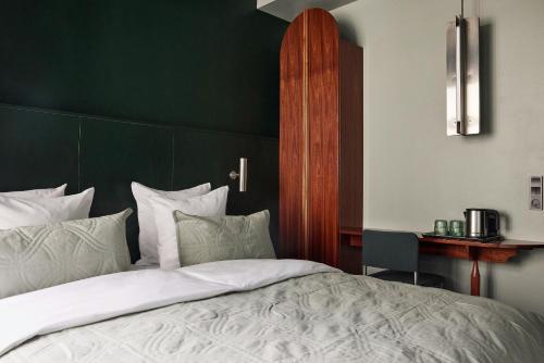 Cama o camas de una habitación en Hotel Hans