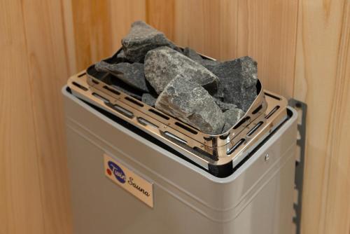a basket of rocks sitting on top of a refrigerator at Aank Ryokan Hotel Ansan Seonbu Branch in Ansan