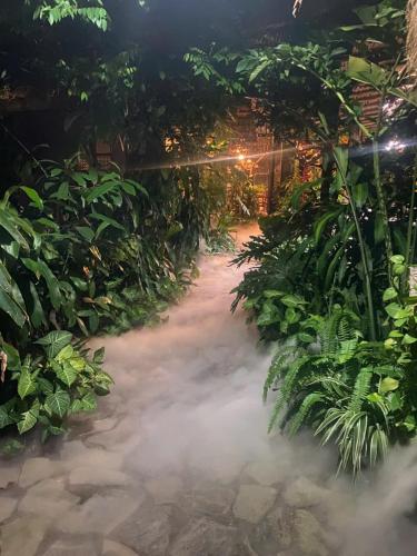 a room with a pile of smoke in a garden at Nhà Lúa Homestay in Ninh Binh