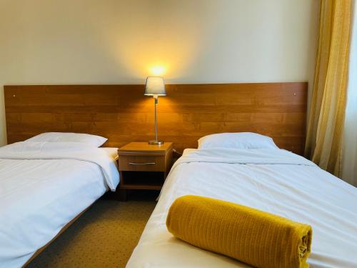 Katil atau katil-katil dalam bilik di Przystań Ostróda - pokoje i apartamenty