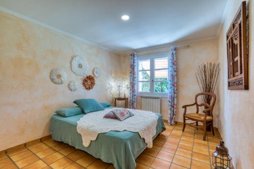 Ένα ή περισσότερα κρεβάτια σε δωμάτιο στο L'évaroma