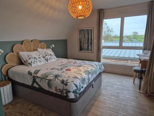 Ένα ή περισσότερα κρεβάτια σε δωμάτιο στο Villa Jacuzzi au pied de la Baie du Mont St Michel