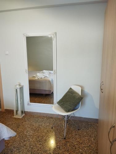 Ένα ή περισσότερα κρεβάτια σε δωμάτιο στο Notos