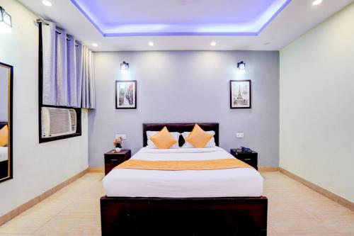 a bedroom with a large bed in a room at Maayra Inn in Noida