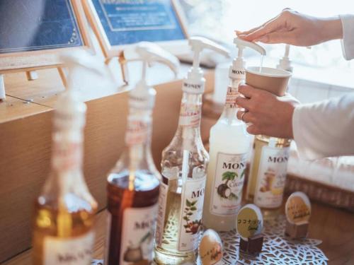 a group of bottles of alcohol on a table at Hotel Areaone Miyazaki in Miyazaki