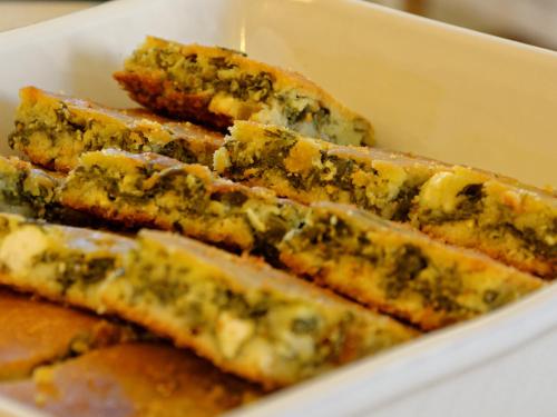a white dish filled with cheese and herbs at Alexandra Hotel in Kalentzi