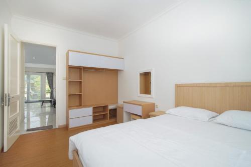 Postel nebo postele na pokoji v ubytování Villa Ixora Resort