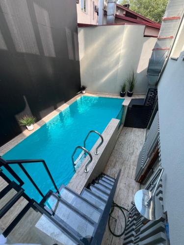 an empty swimming pool with stairs and stepsktopktop at City Park Hotel in Skopje