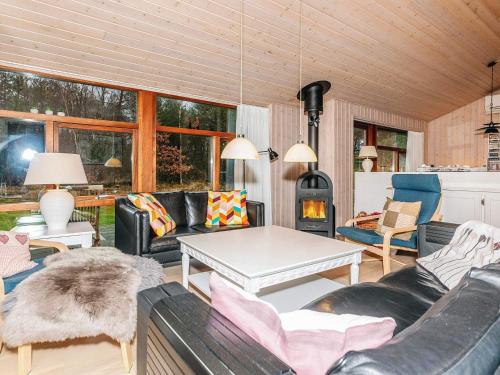 a living room with a couch and a table at 6 person holiday home in Læsø-By Traum in Læsø