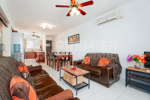 a living room with couches and a dining room at Apartment Olive in Paralimni