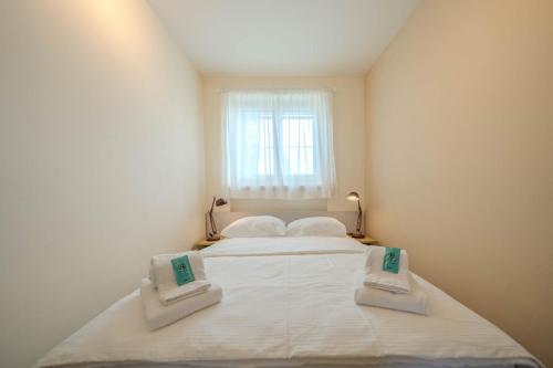 Letto o letti in una camera di Viktoria B33 by Arosa Vacations, Exklusive App mit Bergblick im Zentrum