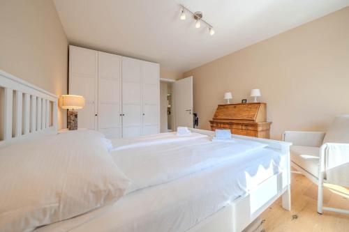 Letto o letti in una camera di Viktoria B33 by Arosa Vacations, Exklusive App mit Bergblick im Zentrum