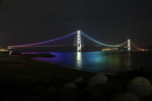 a bridge lit up at night with purple lights at Kobe Sannomiya Tokyu REI Hotel in Kobe