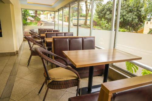 a row of tables and chairs in a restaurant at Methodist Resort in Nairobi