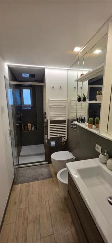 a bathroom with a shower and a toilet and a sink at Al pozzo di Garibaldi in Rome