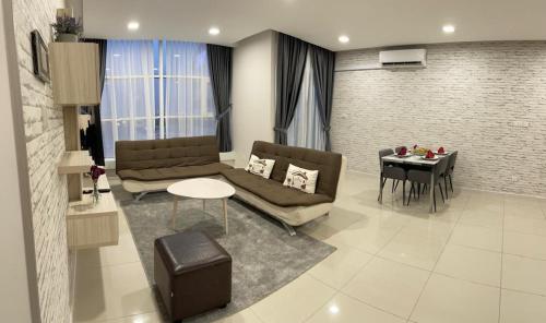 a living room with a couch and a table at Suasana Suites Johor Bahru City Centre in Johor Bahru