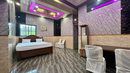 Postel nebo postele na pokoji v ubytování Hotel Buddha