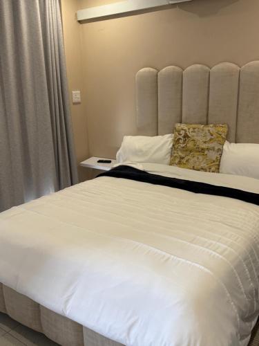 Postel nebo postele na pokoji v ubytování Richards Bay Airport Lodge