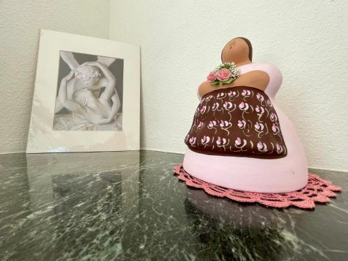 a cake shaped like a swan on a table next to a picture at Bellavista in Neuchâtel