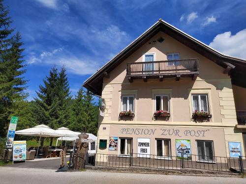 a building with a sign on the side of it at Zur Post in Lackenhof