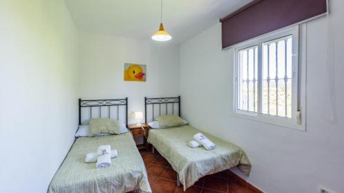 Postel nebo postele na pokoji v ubytování Chalet Algar by Ruralidays