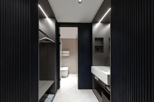 Ένα ή περισσότερα κρεβάτια σε δωμάτιο στο Atour Light Hotel Pazhou Exhibition Center Kecun Subway Station
