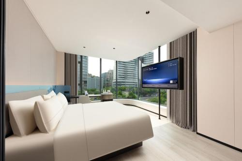 Μια τηλεόραση ή/και κέντρο ψυχαγωγίας στο Atour Light Hotel Pazhou Exhibition Center Kecun Subway Station