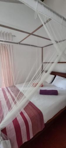 Letto o letti in una camera di Breath House Hiriketiya
