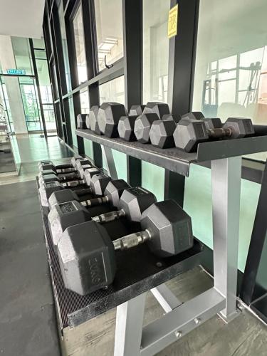 a row of dumbbells on display in a gym at Mid Vally Southkey JB, 2BR, WIFI, 7 mins to CIQ , 5-7pax in Johor Bahru