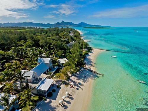 an aerial view of a beach with a resort at Stunning beachfront apartment, Seaview, 20 metres from beach in Blue Bay