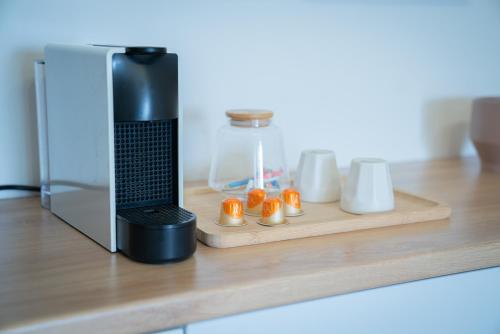 a laptop on a counter next to a microwave at Bel appartement vue mer - Mafat'appart in La Possession